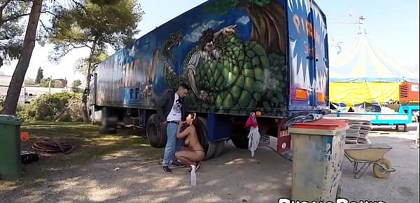  Cute redhead babe gets fucked next to a big truck outside